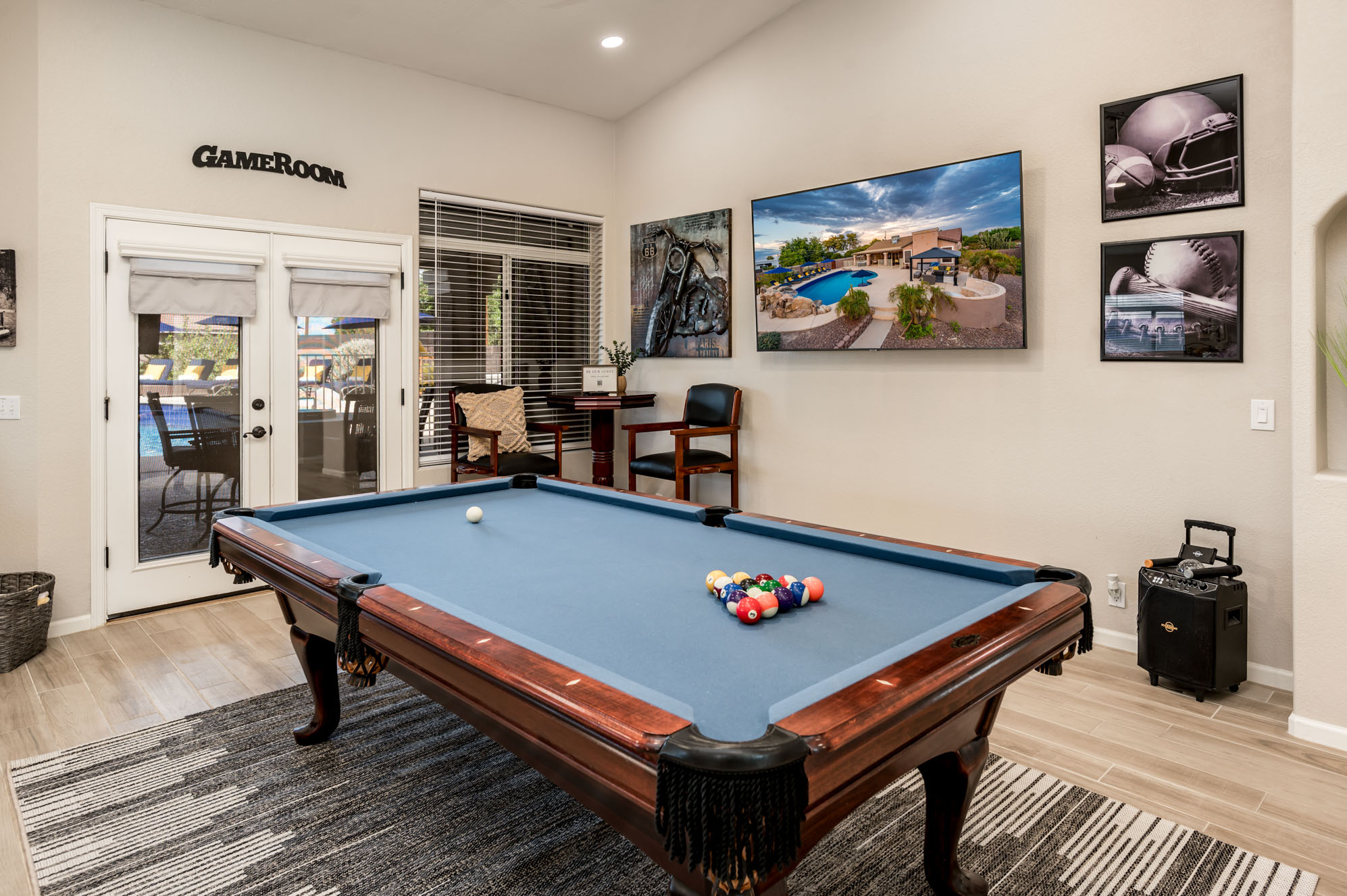 Game room with blue-felt pool table at our Peoria, AZ vacation rental